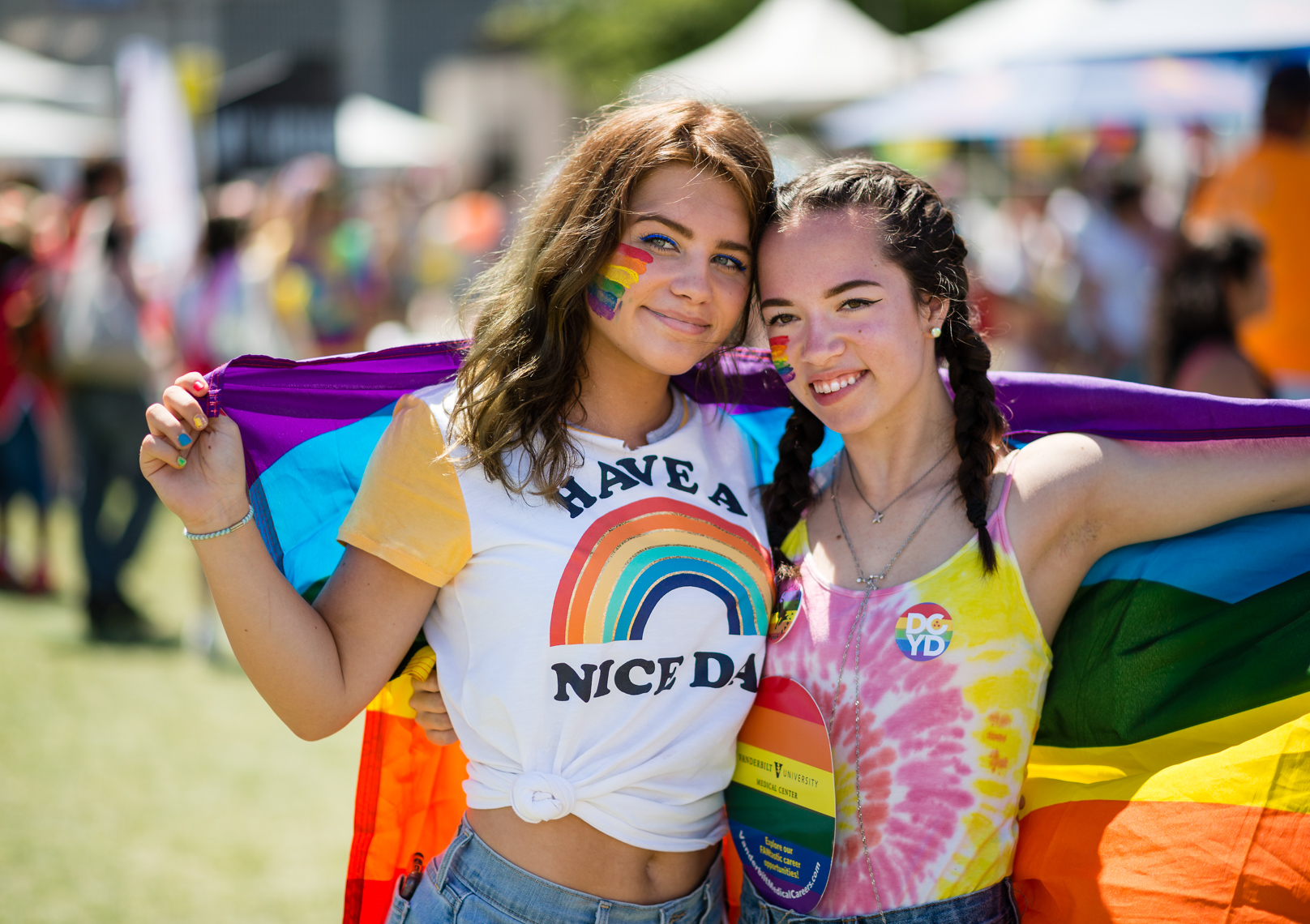 Nashville Pride Festival 2017 | Photographer + Director, Kristina Krug | authentic, authenticity, bisexual, celebrate, celebration, civil, civil liberties, courage, dancing, documentary, drag, emotions, equality, esteem, fearless, festival, festive, free, freedom, friends, fun, gay, happy, journalism, joy, joyful, Kristina Krug, krug photo, lesbian, LGBT, LGBTQ, liberty, love, love wins, loved, love is love, loveliness, lovers, love wins, men, National Pride Day, parade, people, photographer, photojournalism, photojournalist, Portrait, Predators, pride, Pride Parade, proud, queen, queer, relationship, reportage, respect, rights, safety, self, sexuality, summer, sun, sunny, teen girls students holding pride rainbow flag at Public Square Park