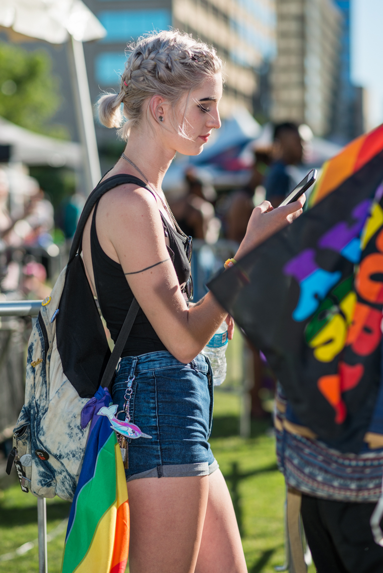 Nashville Pride Festival 2017 | Photographer + Director, Kristina Krug | authentic, authenticity, bisexual, celebrate, celebration, civil, civil liberties, courage, dancing, documentary, drag, emotions, equality, esteem, fearless, festival, festive, free, freedom, friends, fun, gay, happy, journalism, joy, joyful, Kristina Krug, krug photo, lesbian, LGBT, LGBTQ, liberty, love, love wins, loved, love is love, loveliness, lovers, love wins, men, National Pride Day, parade, people, photographer, photojournalism, photojournalist, Portrait, Predators, pride, Pride Parade, proud, queen, queer, relationship, reportage, respect, rights, safety, self, sexuality, summer, sun, sunny, born this way flag, girl on her phone at a music festival