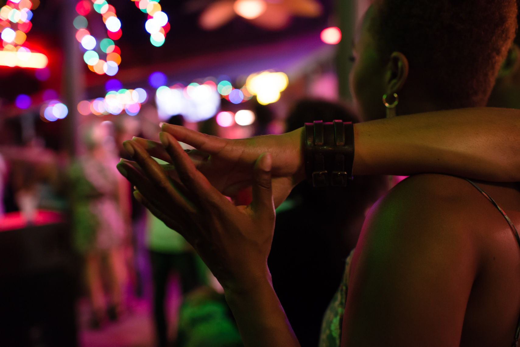 Holding hands in a club, night, bar, New Orleans, young love, New Orleans Photographer, Nashville, Atlanta, Texas, Austin, Chicago, Washington, D.C., DC, together, advertising, beverage, nightlife, photographer, Kristina Krug