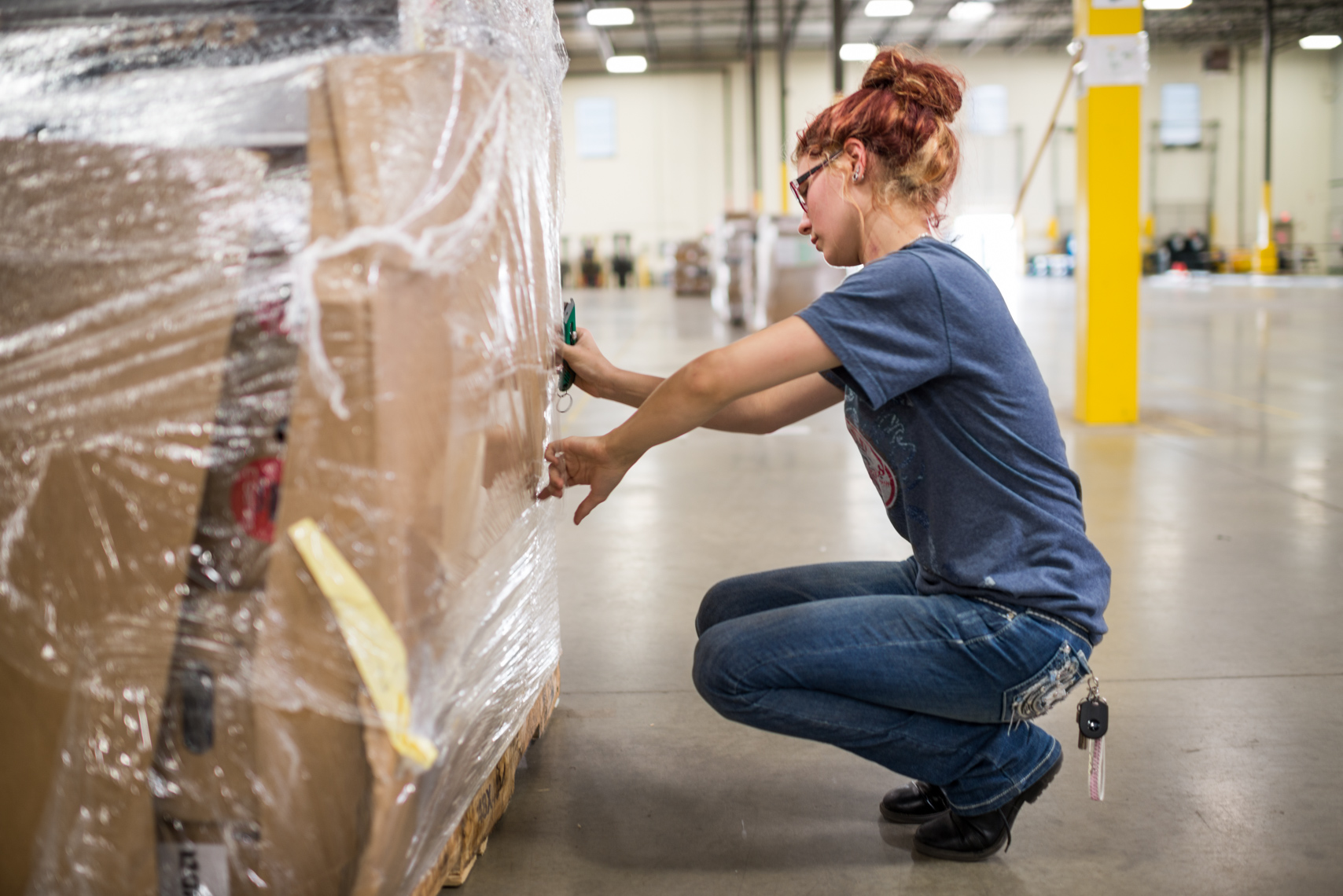 Worker in the Optoro Warehouse in Mount Juliet, TN. Packaging, portrait, women, golden years, lifestyle, journalism, commercial photography.
