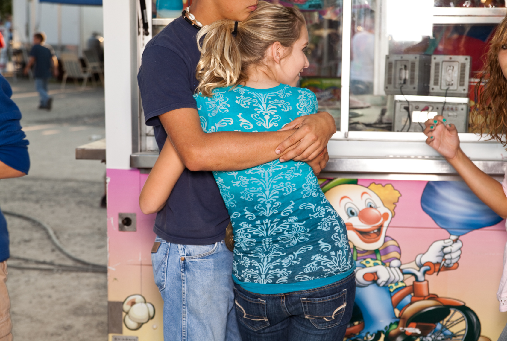 Young teen couple,  Wilson County Fair, Lebanon, Tennessee, carnival, amusement park, rural south, cotton candy, food truck
